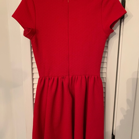 Francesca’s red dress with laser cut details - Picture 3 of 5